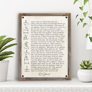 May include: A rustic wood framed print with a white background and black text. The text is a song lyric by Rod Stewart, "Have I Told You Lately That I Love You".