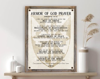 May include: A beige and brown wood-look background with a white text overlay. The text reads "Armor of God Prayer" and includes a list of the armor of God from Ephesians 6:10-18. The text is in a vintage style font.
