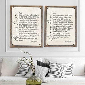 May include: Two framed prints with a rustic wood frame. The prints are on a cream background with black text. The left print is titled "Morning Prayer" and includes a prayer for guidance and strength. The right print is titled "Evening Prayer" and includes a prayer for forgiveness and peace.