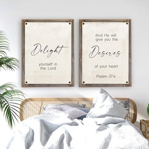 May include: Two framed canvas prints with inspirational quotes. The left print reads "Delight yourself in the Lord". The right print reads "And He will give you the desires of your heart. Psalm 37:4".