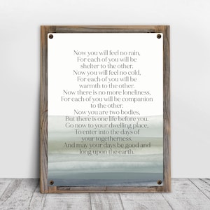 May include: A rectangular metal sign framed in weathered wood featuring black printed text that reads: Now you will feel no rain, For each of you will be shelter to the other. Now you will feel no cold, For each of you will be warmth to the other.