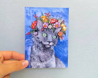 Pussy de carte postale avec des fleurs dans ses cheveux fleur couronne chat