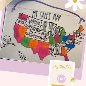 May include: A white dry-erase board with a black outline of the United States. Each state is colored in a different bright color. The board has the words "My Sales Map" written at the top.