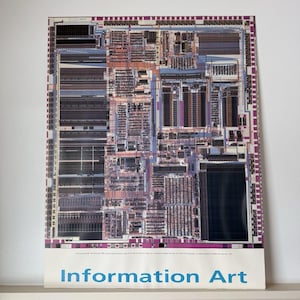 May include: A poster featuring a detailed, colorful illustration of a computer chip's internal components. The image has a complex, intricate design with various shades of purple, blue, and brown. The text "Information Art" is printed in blue at the bottom.