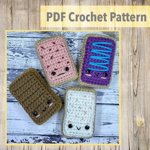 May include: Four crocheted stuffed toys shaped like pop-tart pastries with different colored frosting and faces.  PDF Crochet Pattern.