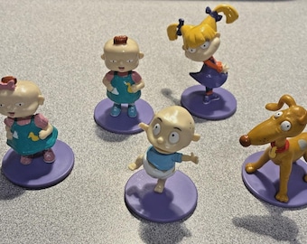 Figuras vintage de PVC pintadas de Rugrats (5 unidades): Tommy, Angelica, Phil y Lil Spike.