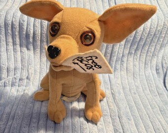 Peluche vintage de Chihuahua de Taco Bell con cartel de "Tacos gratis" - Década de 1990