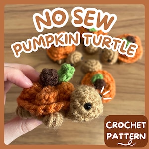 May include: Crochet pattern for a no-sew pumpkin turtle. The pattern includes instructions for making a small, orange pumpkin-shaped turtle with green leaves and brown stem.