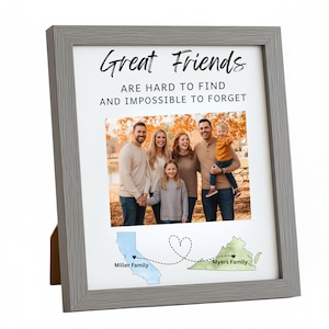 May include: A framed photo print with a gray wooden frame. The print features a family photo and the text "Great Friends are hard to find and impossible to forget." Below the photo are map outlines of California and Virginia, connected by a dotted line.
