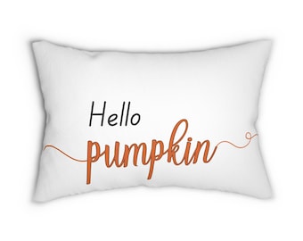 May include: White throw pillow with the text "Hello pumpkin" in orange cursive lettering.