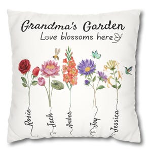 May include: White throw pillow with the text "Grandma's Garden Love blossoms here" and a butterfly graphic. Five different flowers are depicted with names written below each: Rosie, Jack, Amber, Joy, and Jessica.