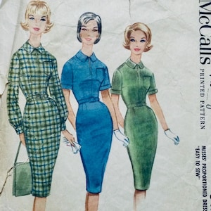 May include: Vintage McCall's sewing pattern for a misses' proportioned dress. The pattern is for a dress with a collar and short sleeves. The pattern is printed on white paper with a blue and green color scheme. The pattern number is 547.
