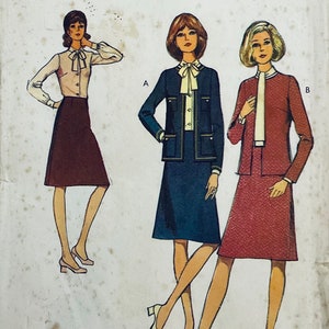 May include: Vintage sewing pattern showing three women's outfits. The illustrations depict a skirt suit, a dress with a jacket, and a blouse with a skirt. The outfits are in shades of brown, navy, and red, with white accents. The pattern is on a worn, off-white background.