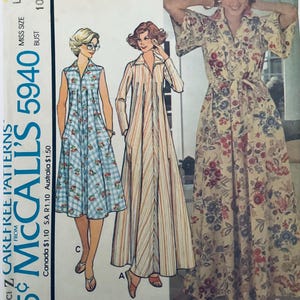 May include: McCall's 5940 sewing pattern for a misses' housedress or robe in size large 18-20, 102-107 cm bust. The envelope displays three variations: a sleeveless blue plaid dress with floral accents, a long-sleeved striped dress, and a floral print robe.