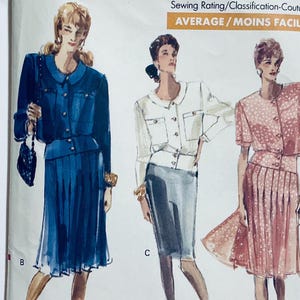 May include: Three different sewing patterns for women's suits. The first pattern is for a blue suit with a jacket and skirt. The second pattern is for a white jacket and a gray skirt. The third pattern is for a pink jacket and skirt. The text on the image reads "Sewing Rating/Classification-Couture AVERAGE/MOINS FACILE".