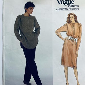May include: A vintage Vogue Patterns sewing pattern featuring an American Designer. The pattern includes illustrations of a long-sleeved dress with a belt and a long-sleeved top with trousers. The Vogue Patterns logo is at the top.
