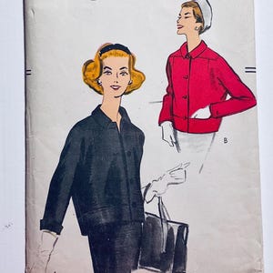 May include: Vintage sewing pattern with illustrations of women's jackets. One woman is wearing a black jacket, and the other is wearing a red jacket. The pattern includes a black handbag and white gloves. The background is off-white.