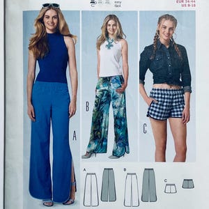 May include: A sewing pattern showing three garment styles: wide-leg trousers, patterned palazzo pants, and checked shorts. The models are wearing the clothes. The pattern includes line drawings of each garment.