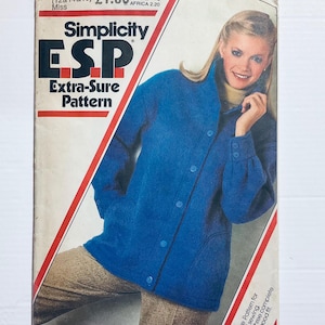 May include: A vintage Simplicity ESP Extra-Sure Pattern sewing pattern. The cover features a woman wearing a blue jacket with button details. The pattern is for a three-piece complete wood fit.