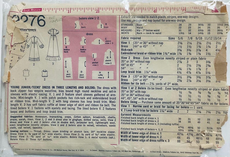 Cute dress with high round neckline and either short very puffy sleeves or set in sleeves with puffy gathers at wrist. Gathered high waist and optional gathered lower skirt band. Patch pockets, trim and lined bolero.