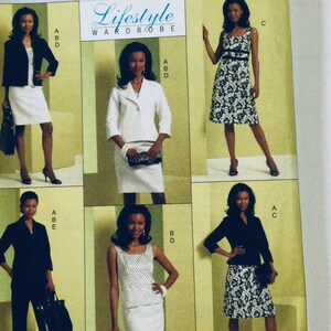 May include: A sewing pattern booklet featuring five different outfit designs for women. The designs include a white blazer and skirt, a black blazer and trousers, a white and black patterned dress, a white and black patterned top and skirt, and a black and white patterned dress.