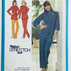 May include: A sewing pattern for a two-piece outfit featuring a long-sleeved top and trousers. The pattern is for stretch knit fabric and includes three different views. The first view shows a red top with yellow trousers, the second view shows a red top with red trousers, and the third view shows a blue top with blue trousers. The pattern is titled "Time Saver Stretch Knit".