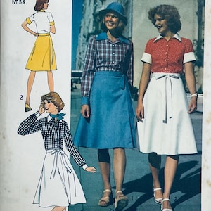 May include: A vintage sewing pattern featuring three women wearing different styles of skirts. The skirts are all knee-length and have a wrap-around design. The women are wearing blouses with different patterns and colors. The pattern is for Miss sizes.