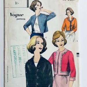 May include: A vintage Vogue sewing pattern featuring three women wearing different styles of jackets. The pattern is for a jacket with a collar and buttons. The text on the pattern reads "Vogue pattern" and "Paper cannot be exchanged in any circumstances."