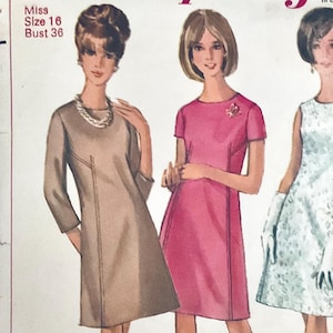 May include: A vintage sewing pattern envelope featuring illustrations of three dresses: a beige three-quarter sleeve dress, a pink short-sleeve dress, and a sleeveless light blue patterned dress. Text includes Miss Size 16 and Bust 36.