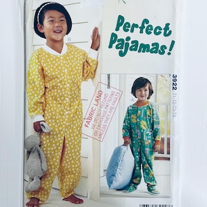 May include: Two children wearing pajamas. The child on the left is wearing a yellow and white floral print pajama set and holding a stuffed animal. The child on the right is wearing a green and white pajama set with a print of animals. The text "Perfect Pajamas!" is printed on the image.