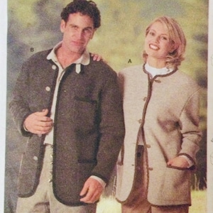 May include: Two jackets, one in a dark brown colour and the other in a light beige colour. Both jackets have a collar and a button closure. The jackets have a trim around the collar, pockets, and cuffs.