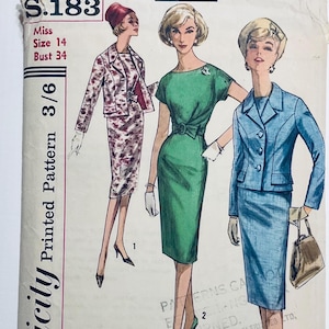 May include: A vintage sewing pattern showing illustrations of women's suits and dresses. The pattern includes a jacket and skirt suit, a green dress with a belt, and a blue suit. The pattern is labelled S.183, Miss Size 14, Bust 86 cm.