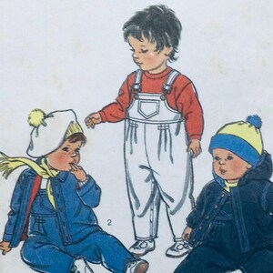 May include: A vintage sewing pattern for children's clothing. The pattern includes three different designs: a white overall with a red shirt, a blue denim jacket with a yellow scarf, and a blue and yellow jacket with a blue hat.