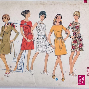 May include: Vintage sewing pattern envelope featuring illustrations of six different dresses. The dresses are in various styles and colors, including yellow, red, and floral prints. The envelope has the word "Style" and the number "2764" printed on it. The bust size is 36 inches.