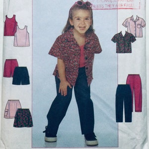 May include: A sewing pattern for a child's outfit. The pattern includes a short-sleeved shirt with a floral print, a pair of pants, a skirt, and two tank tops. The pattern is shown on a white background.