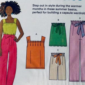 May include: A sewing pattern for four summer clothing items: a bright yellow tank top, an orange tank top, a green skirt with a bow, and pink pants with a bow.
