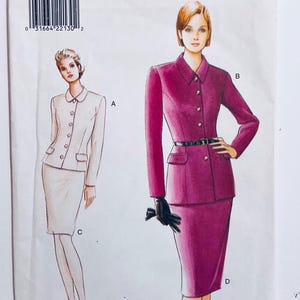 May include: Illustration of two women's suits. One is a light beige suit with a collared jacket and a pencil skirt. The other is a magenta suit with a collared jacket, a pencil skirt, and a black belt. The image is on a white background.