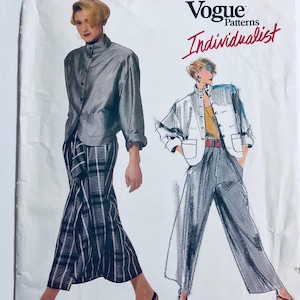 May include: Vogue Patterns Individualist sewing pattern. The image shows two fashion illustrations. One figure is in a grey jacket and plaid trousers. The other is in a white jacket, grey trousers, and a red belt.
