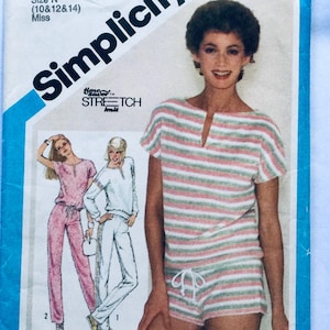 May include: A sewing pattern for a striped knit top and shorts set. The pattern is from Simplicity and features a time saver stretch knit fabric. The pattern is for sizes 10, 12, and 14.