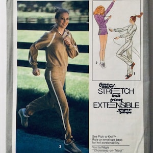 May include: A vintage sewing pattern featuring a woman wearing a brown tracksuit with white stripes. The pattern is for a "Time Saver Stretch Knit Tricot Extensible" fabric. The text "See Pick-a-Knit™ Rule on envelope back for knit stretchability. Voir la Règle "Choisissez-un-Tricot" is also included.
