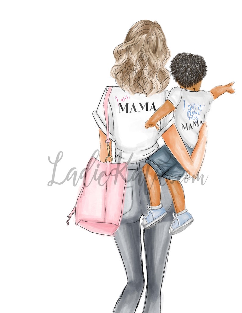 May include: A woman wearing a white t-shirt with the text "I am Mama" and jeans is holding a child wearing a white t-shirt with the text "I got it from my Mama" and blue shorts. The woman is carrying a pink tote bag.