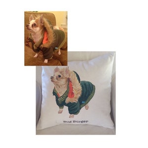 May include: A white pillow with a printed image of a small, light brown chihuahua wearing a green and orange jacket. The text "Bug Burger" is printed below the image.
