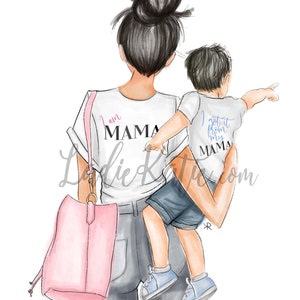 May include: A woman wearing a white t-shirt with the text "I am Mama" and a pair of jeans is carrying a young boy on her hip. The boy is wearing a white t-shirt with the text "I got it from my Mama". The woman is carrying a pink tote bag.