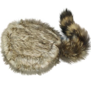 May include: A brown and gray faux fur hat with a long, bushy tail attached. The hat is round and fluffy, and the tail is long and thick.
