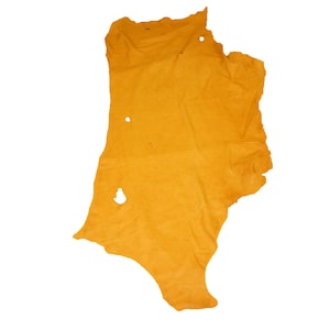 May include: A large piece of yellow leather with several holes.