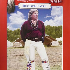 May include: A man wearing a burgundy shirt, white pants, and a brown belt with a silver buckle. He is wearing a beaded necklace and has long brown hair. The image is from a pattern book for buckskin pants. The text on the image reads "Missouri River, Developed by master craftworkers, Brand, The Very Best!, Buckskin Pants, Pattern No. 4799-500-001".