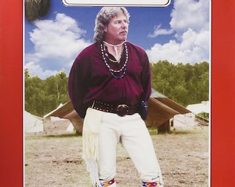 May include: A man wearing a burgundy shirt, white pants, and a brown belt with a silver buckle. He is wearing a beaded necklace and has long brown hair. The image is from a pattern book for buckskin pants. The text on the image reads "Missouri River, Developed by master craftworkers, Brand, The Very Best!, Buckskin Pants, Pattern No. 4799-500-001".