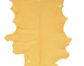 May include: A large, pale yellow leather hide with a slightly irregular shape. The hide has a smooth, soft texture and is suitable for crafting.