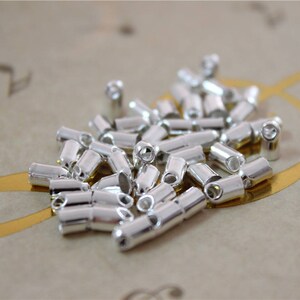100 Stück silberne Metall-Kordel-Endkappen 3mm