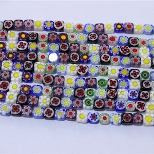 a string of 65 pcs beads millefiori glass flattened square multicolor